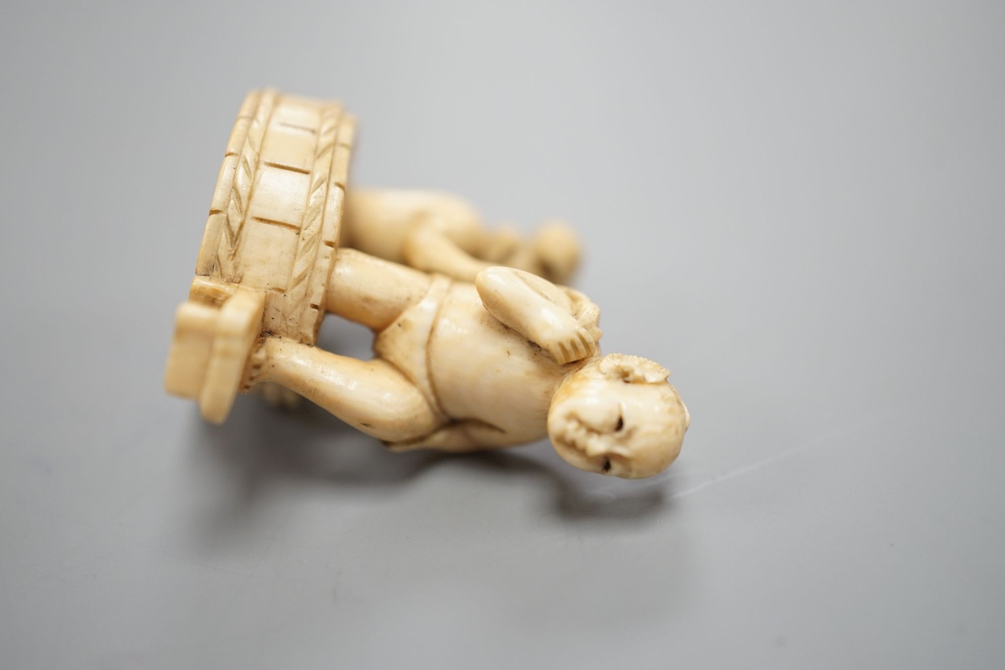 A Japanese ivory Netsuke of a bathing couple, Meiji period, 3.5 cms high.